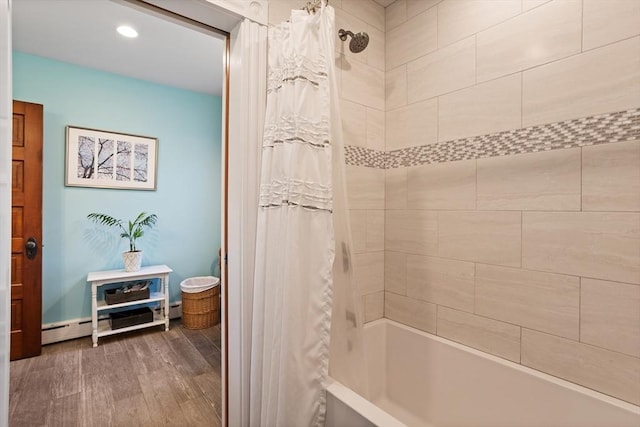 18 Hill St, Lexington, MA 02421 - full bathroom featuring wood finished floors, a baseboard heating unit, shower / bathtub combination with curtain, and recessed lighting