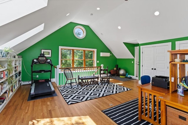 18 Hill St, Lexington, MA 02421 - rec room featuring wood finished floors, lofted ceiling, baseboards, and a wall mounted air conditioner