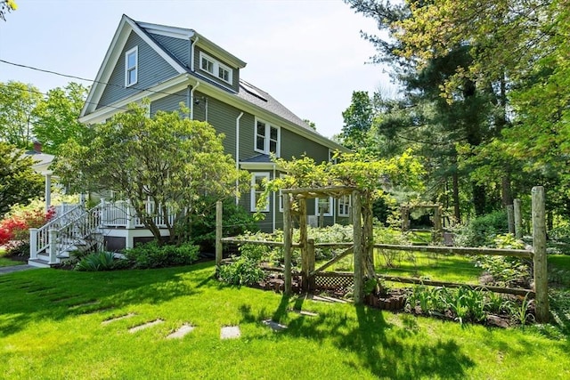 18 Hill St, Lexington, MA 02421 - rear view of house with a lawn, covered porch, and stairs
