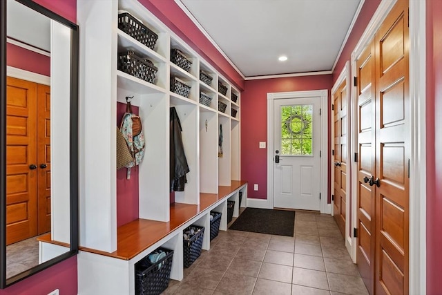 18 Hill St, Lexington, MA 02421 - mudroom featuring tile patterned floors, baseboards, and crown molding