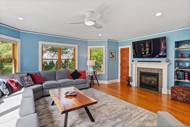 18 Hill St, Lexington, MA 02421 - living room featuring a ceiling fan, plenty of natural light, ornamental molding, wood finished floors, and a fireplace