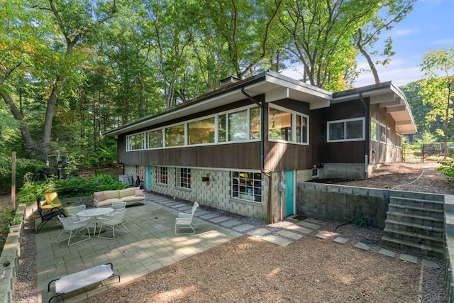 rear view of house with a patio area