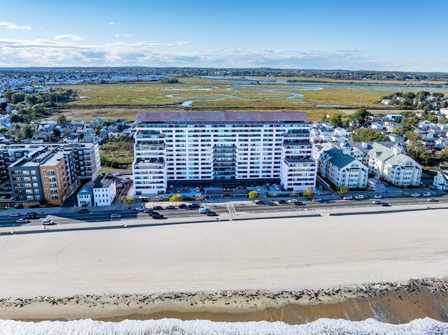 drone / aerial view of waterfront with a beach