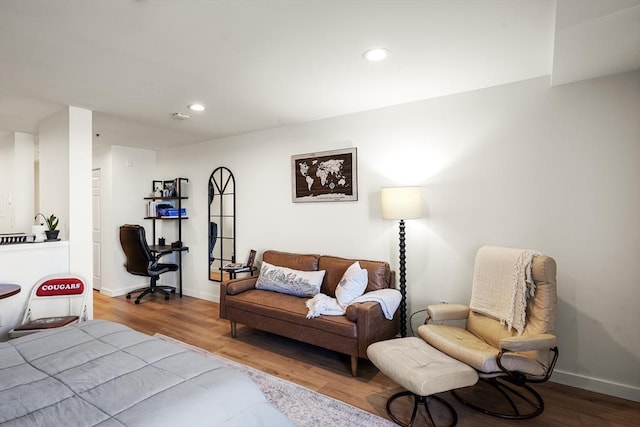 living area featuring wood finished floors, recessed lighting, and baseboards