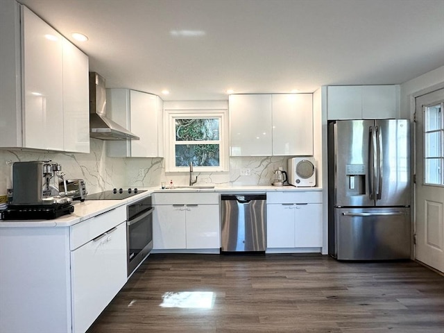 197 Winn St, Burlington, MA 01803 - kitchen featuring white cabinets, stainless steel appliances, plenty of natural light, and wall chimney exhaust hood