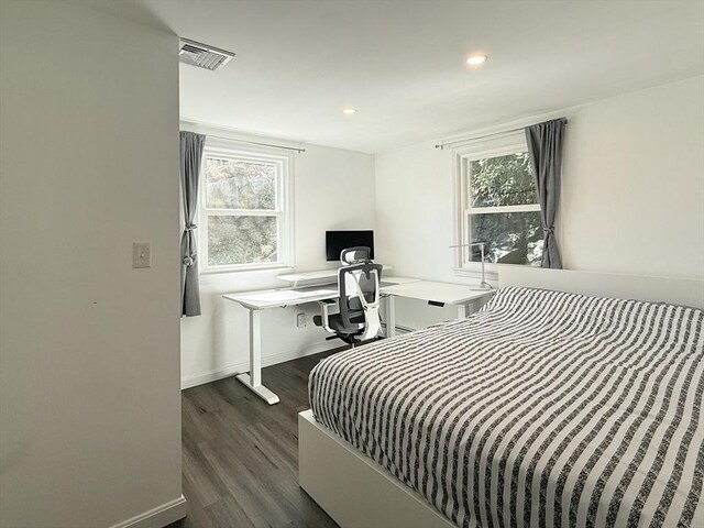 197 Winn St, Burlington, MA 01803 - bedroom with baseboards, multiple windows, dark wood-style flooring, and visible vents