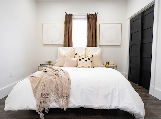 bedroom featuring dark hardwood / wood-style floors