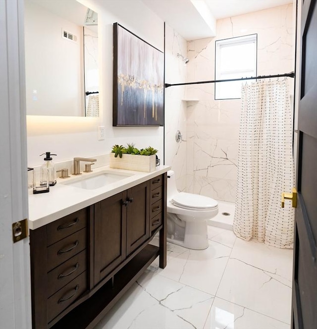 full bathroom featuring vanity, toilet, marble finish floor, a shower stall, and visible vents