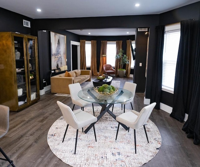 dining space with visible vents, recessed lighting, wood finished floors, and a healthy amount of sunlight