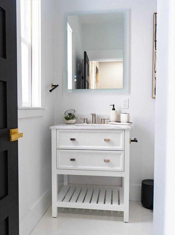 bathroom featuring tile patterned floors and vanity