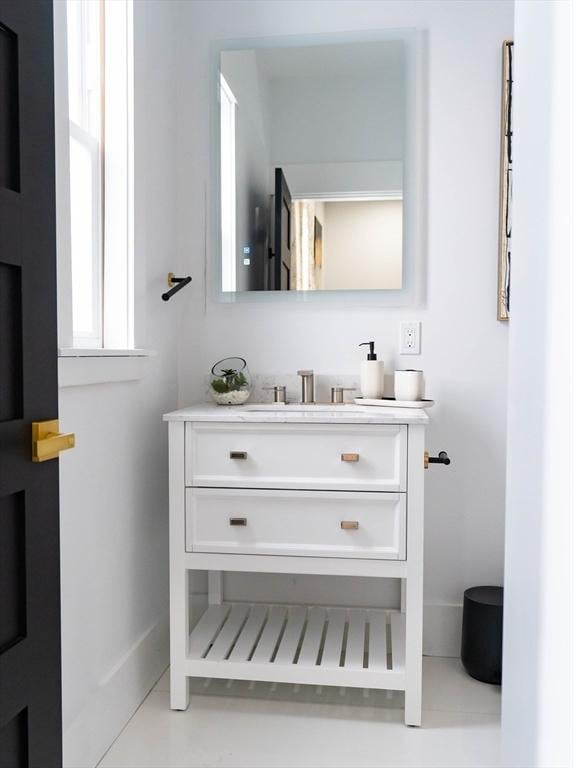bathroom with baseboards and vanity