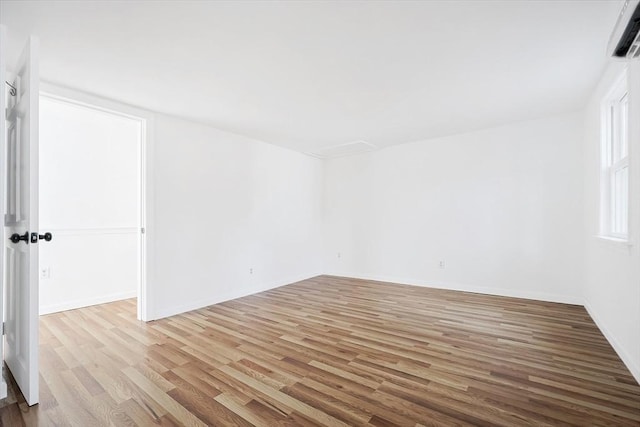 unfurnished room featuring light hardwood / wood-style flooring