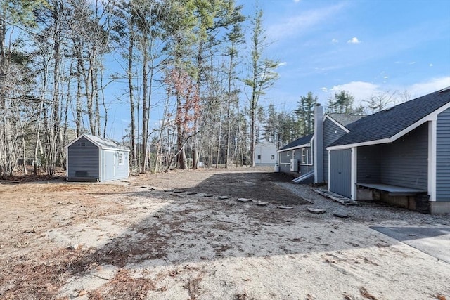 view of yard with a storage shed