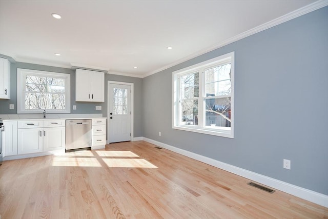 kitchen featuring sink, crown molding, light hardwood / wood-style flooring, dishwasher, and white cabinets