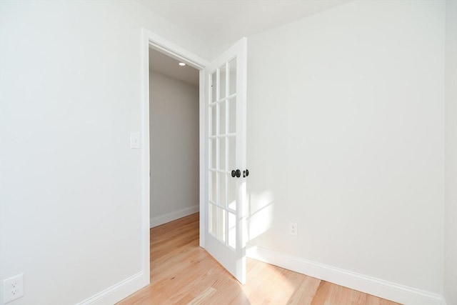 hall with light wood-type flooring