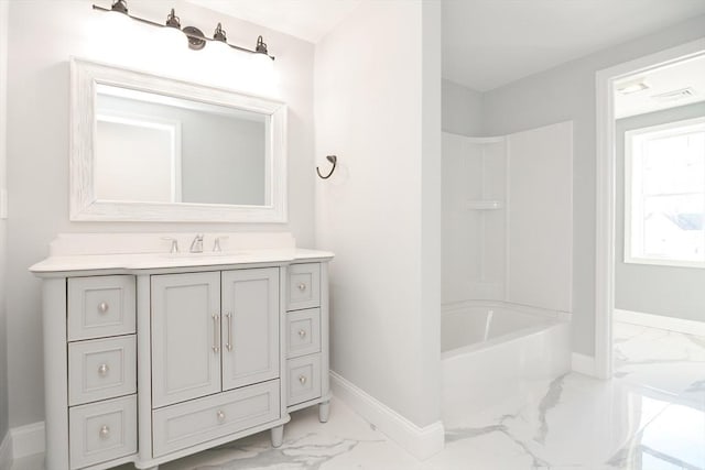 bathroom featuring shower / bath combination and vanity