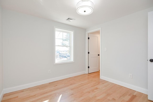 spare room with light hardwood / wood-style floors