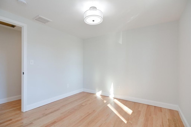 unfurnished room featuring light wood-type flooring