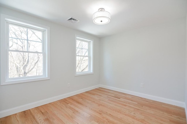 unfurnished room featuring light wood-type flooring