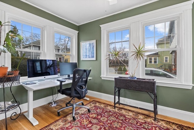 office with baseboards, crown molding, and wood finished floors