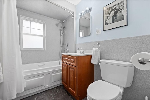 full bathroom with vanity, shower / bathtub combination with curtain, and toilet
