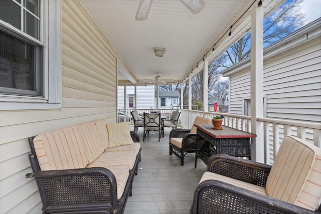 exterior space featuring ceiling fan, an outdoor living space, and outdoor dining space