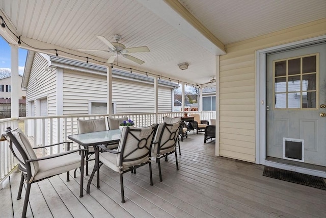 deck with ceiling fan and outdoor dining area