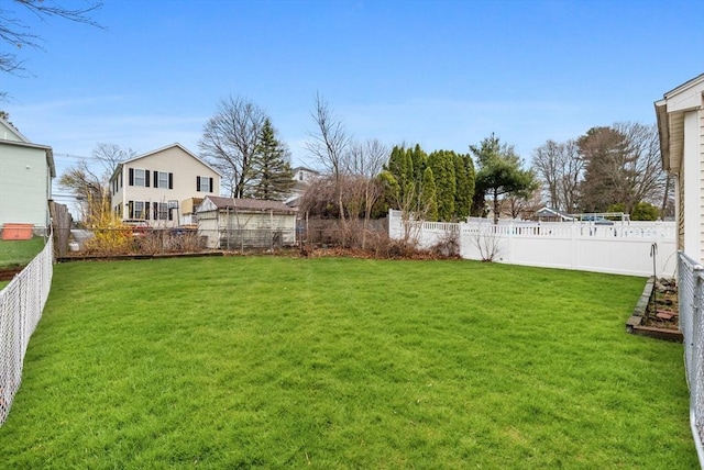 view of yard with a fenced backyard