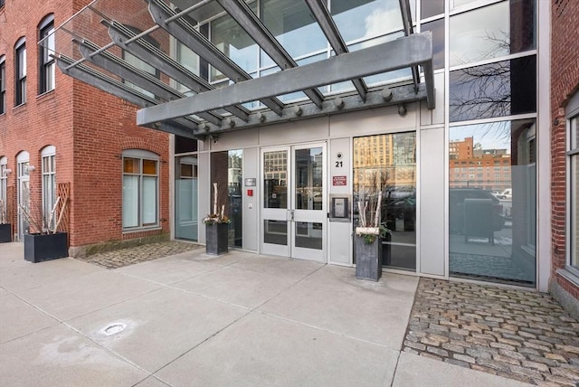 view of exterior entry featuring french doors