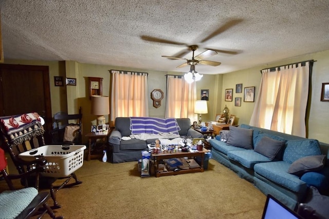 living room featuring ceiling fan, carpet, and a textured ceiling