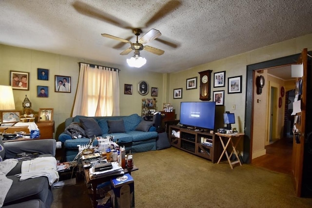 carpeted living room featuring ceiling fan and a textured ceiling