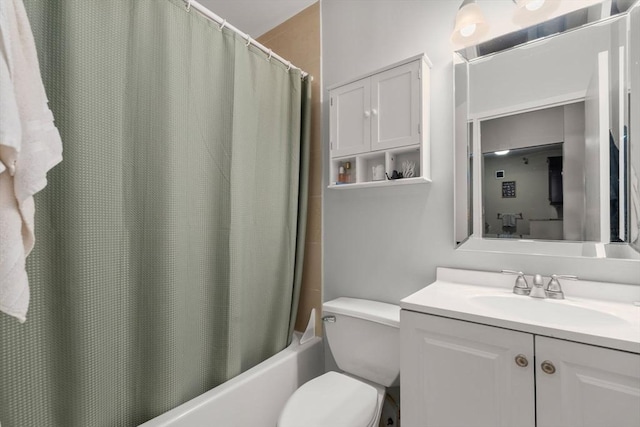 full bathroom with vanity, shower / bath combo, and toilet