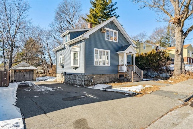 view of property featuring an outbuilding and a garage