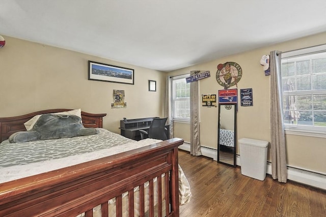 bedroom with baseboards and dark wood-style floors