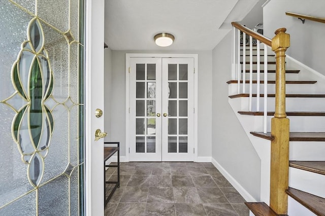 doorway to outside with stairs, baseboards, and french doors