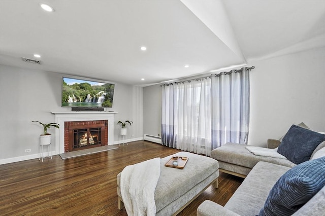 living room with visible vents, a baseboard radiator, a wealth of natural light, and recessed lighting