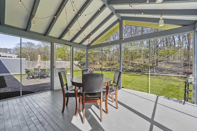 sunroom / solarium featuring outdoor dining area