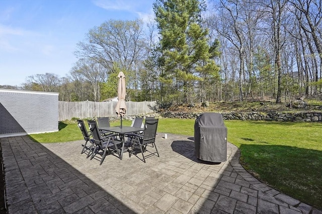 view of patio / terrace featuring fence and outdoor dining space