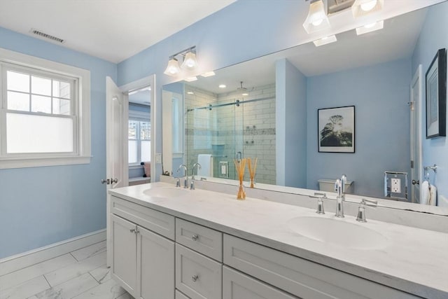 bathroom with walk in shower, vanity, and toilet