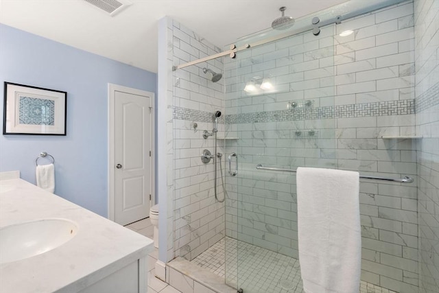 bathroom with vanity, an enclosed shower, and toilet