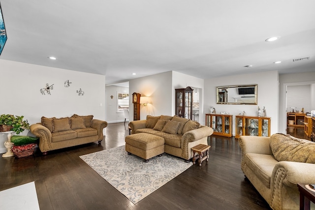 living room with dark hardwood / wood-style flooring