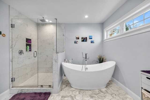 bathroom with separate shower and tub