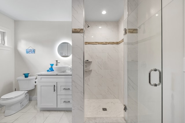 bathroom with vanity, toilet, and walk in shower