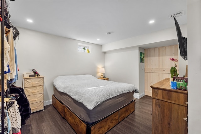 bedroom featuring dark wood-type flooring