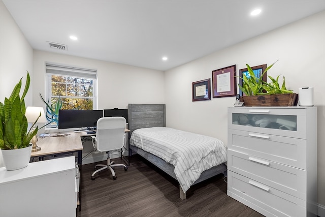 bedroom featuring dark hardwood / wood-style flooring