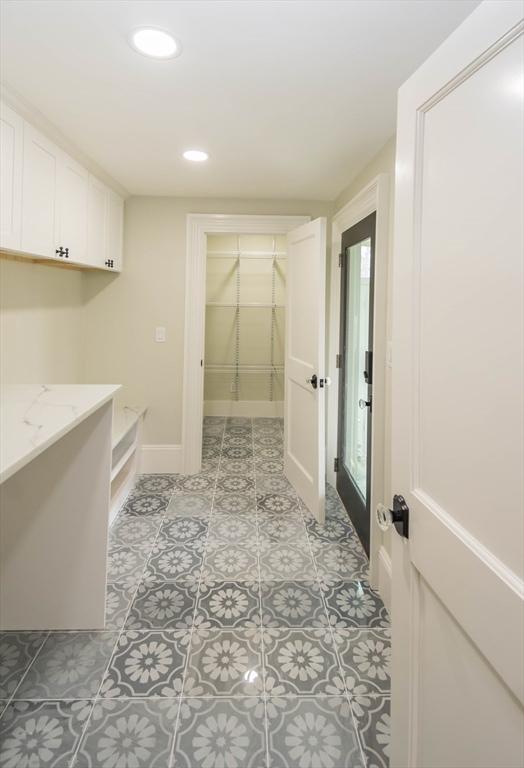 washroom with recessed lighting and baseboards