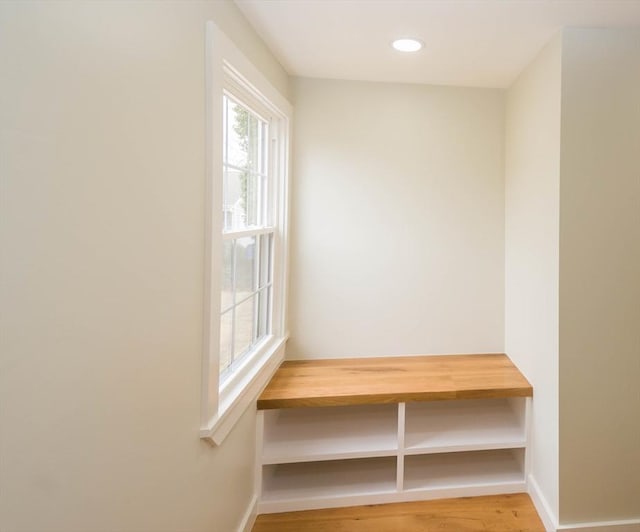 mudroom with recessed lighting, baseboards, and light wood-type flooring