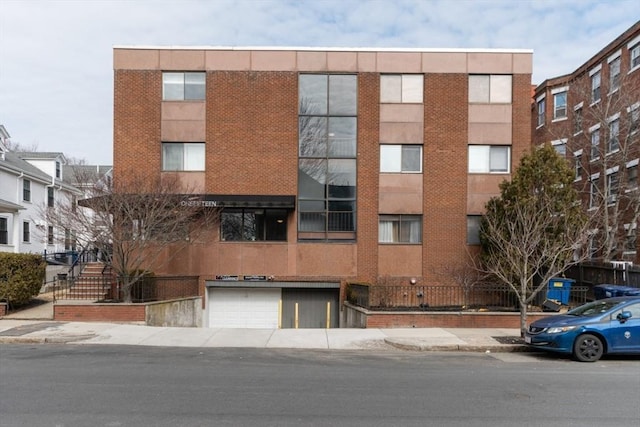 115 Highland Ave Unit 11, Somerville, MA 02143 - view of apartment building / complex with a garage