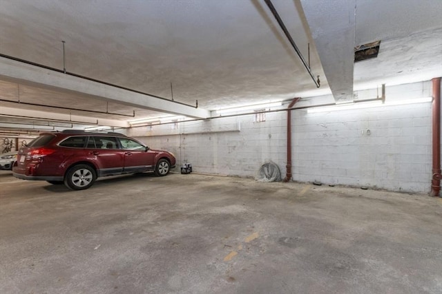 115 Highland Ave Unit 11, Somerville, MA 02143 - parking deck featuring concrete block wall