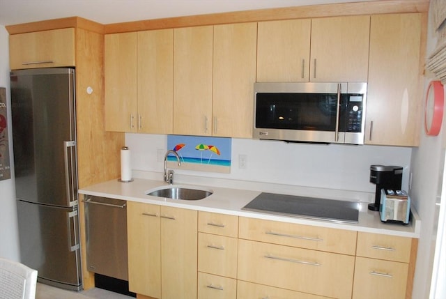 5 Hydrangea Ln Unit 5, Mashpee, MA 02649 - kitchen featuring appliances with stainless steel finishes, light brown cabinets, and light countertops